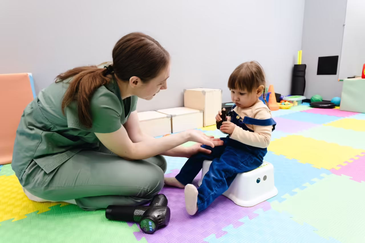 child receiving physical therapy from woman in cli 2026 03 25 05 35 10 utc