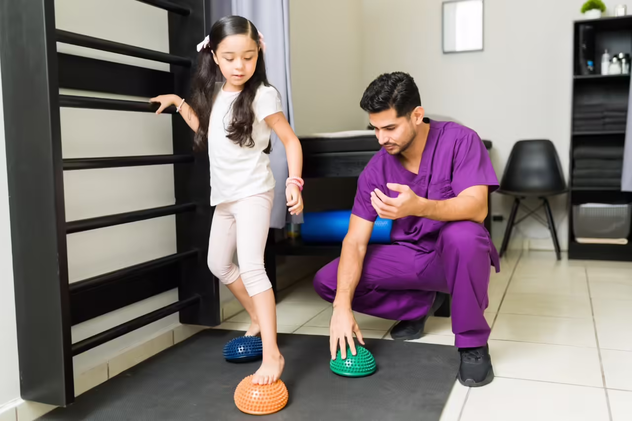 girl with therapist doing balance exercises in cli 2026 03 27 00 54 43 utc