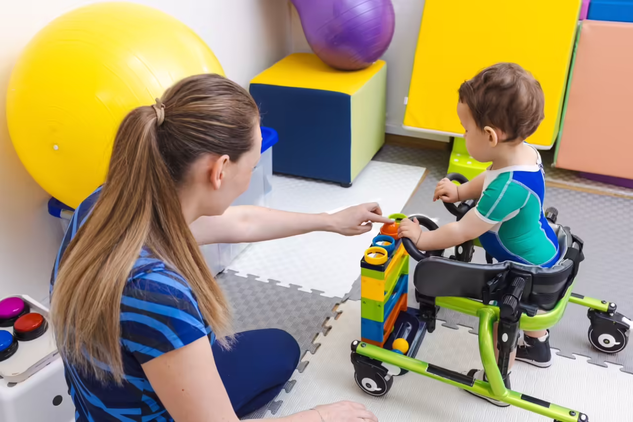 physical therapy professional helps toddler learn 2026 03 25 04 44 24 utc
