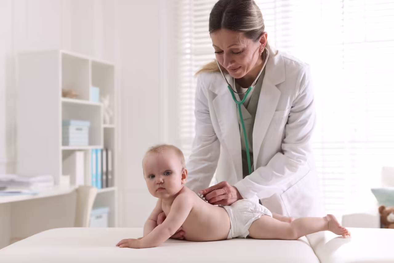 pediatrician examining cute baby with stethoscope 2026 05 20 16 13 59 utc