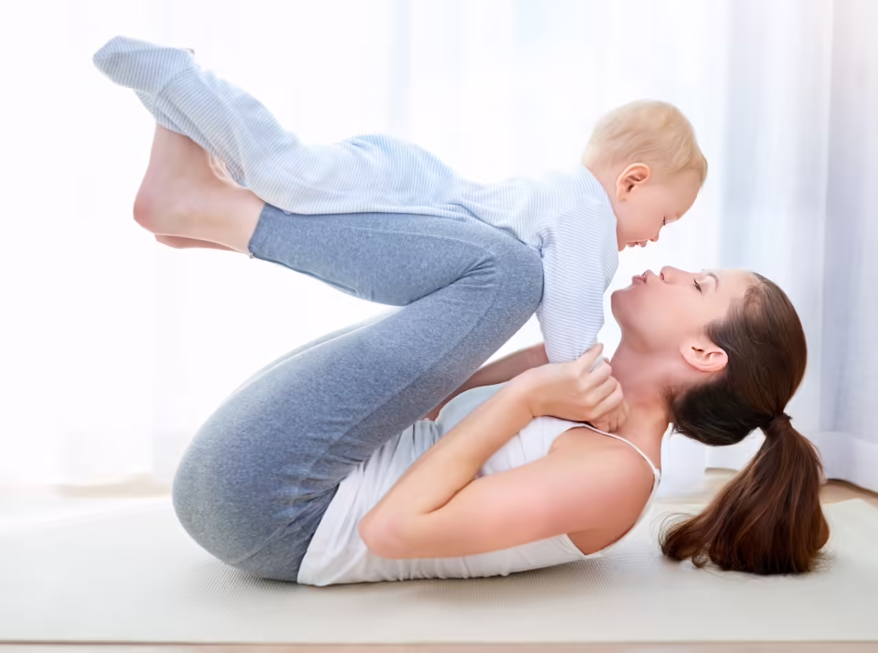 woman holding baby during exercise at home 2026 03 25 02 50 10 utc