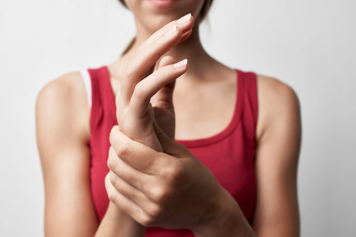 woman massaging her sore wrist joint