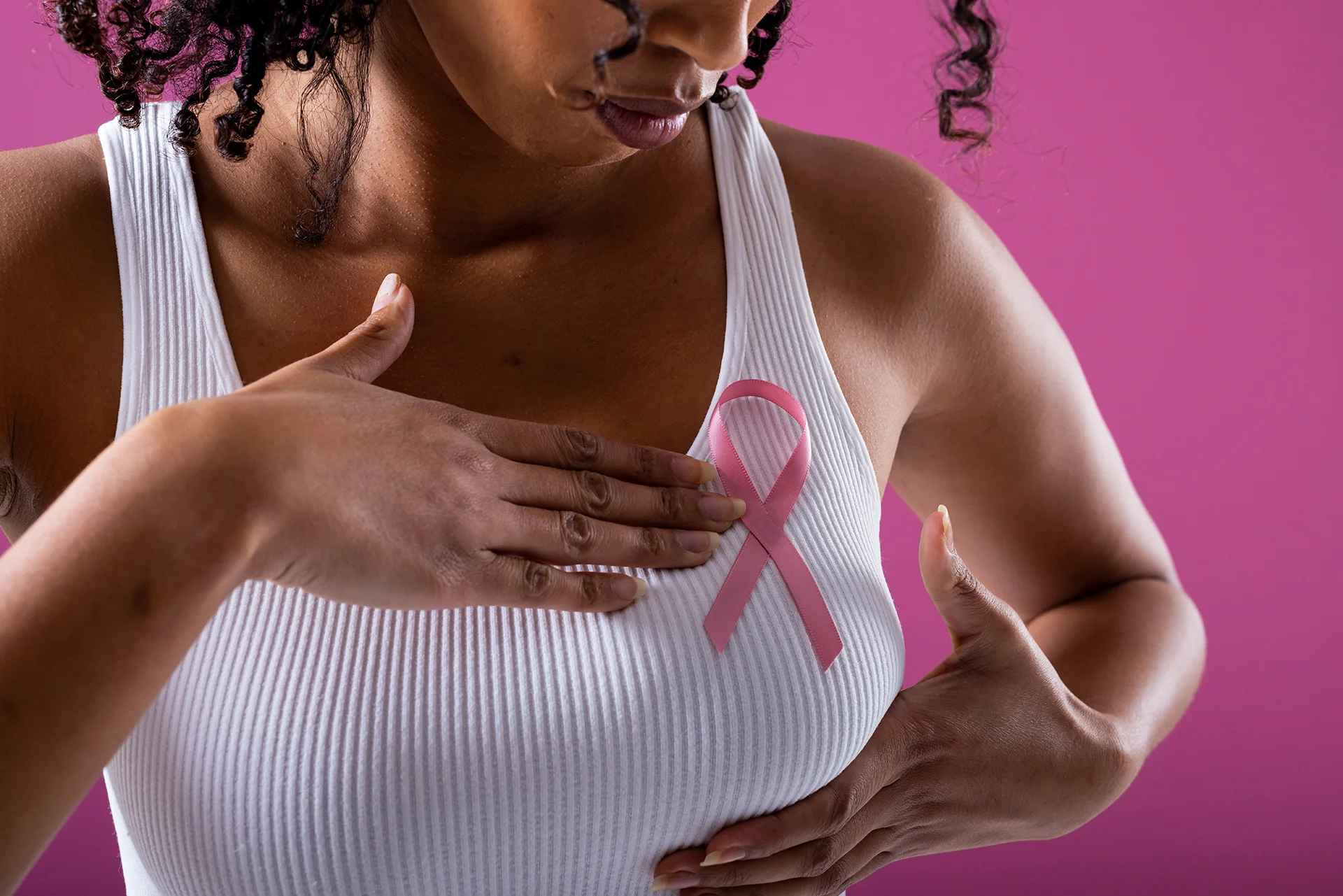 woman supporting breast cancer awareness with pink