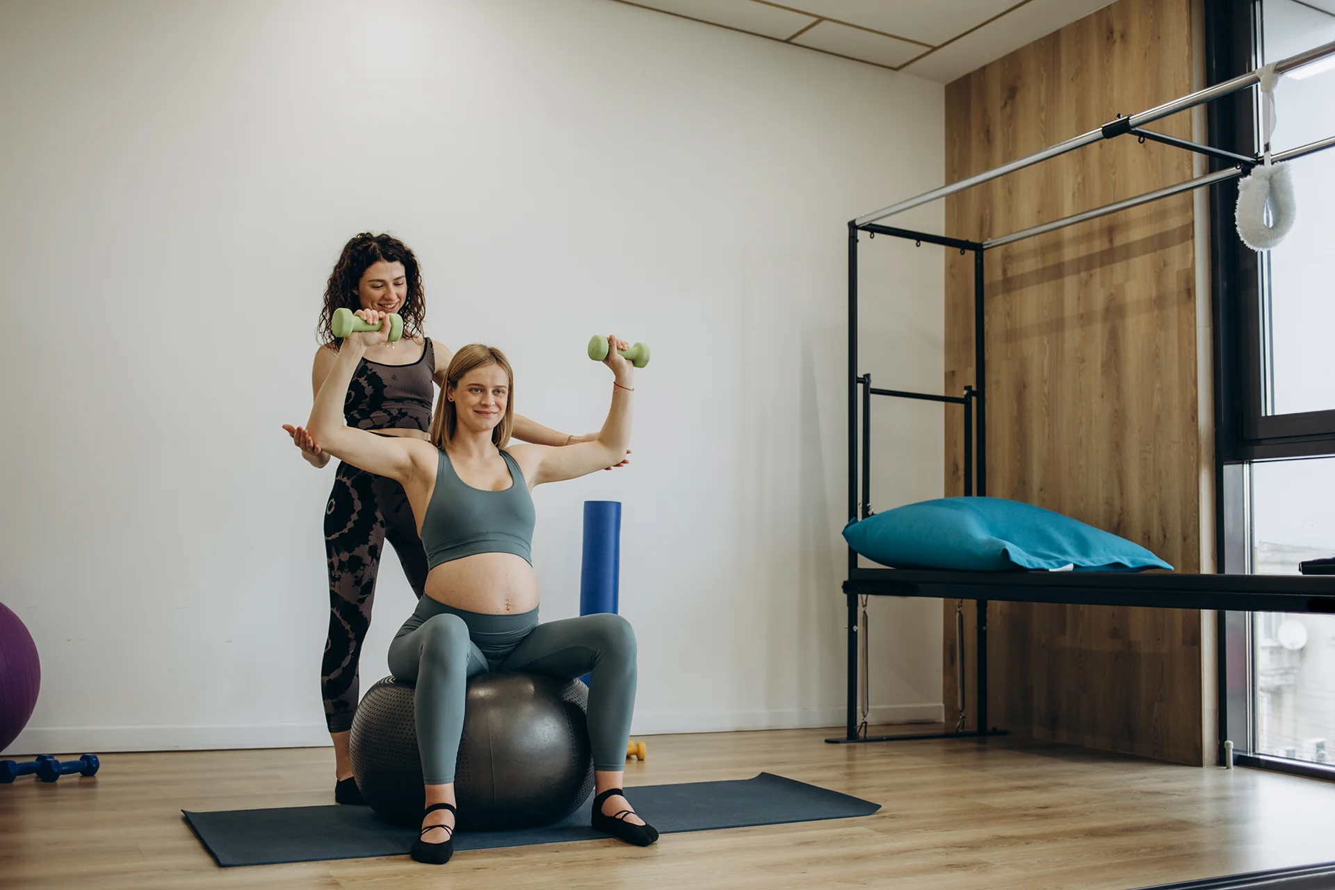 woman working out with trainer on